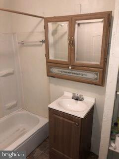 903 Wagontown Road Coatesville, PA 19320 - Photo 12 of 12 a bathroom with a sink and a mirror