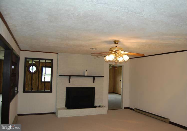 38141 Dukeharts Coltons Point, MD 20626 - Photo 17 of 25 a front view of a house with a fireplace