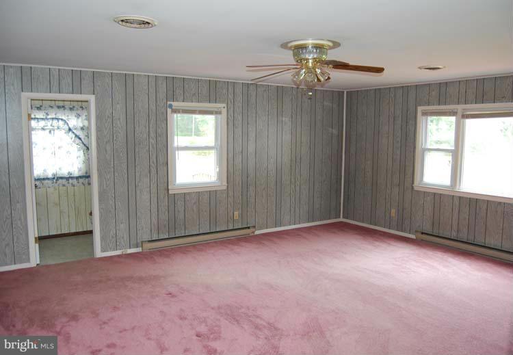 38141 Dukeharts Coltons Point, MD 20626 - Photo 21 of 25 an empty room with windows and fan