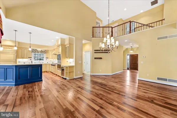 a kitchen with stainless steel appliances a stove a sink and a microwave