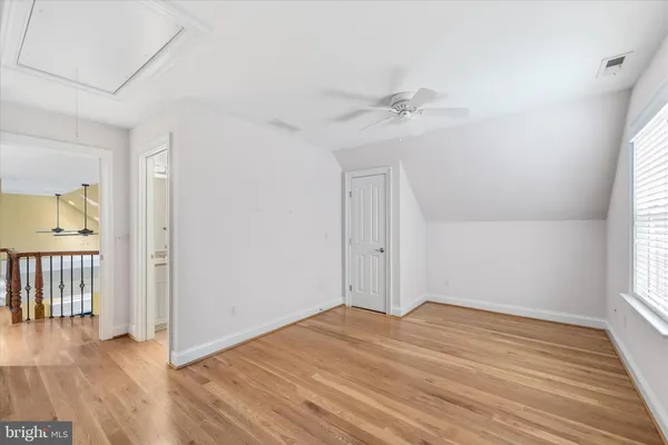 a view of a big yard with a house in the background