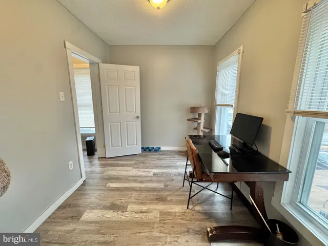 a view of a livingroom with furniture and a window