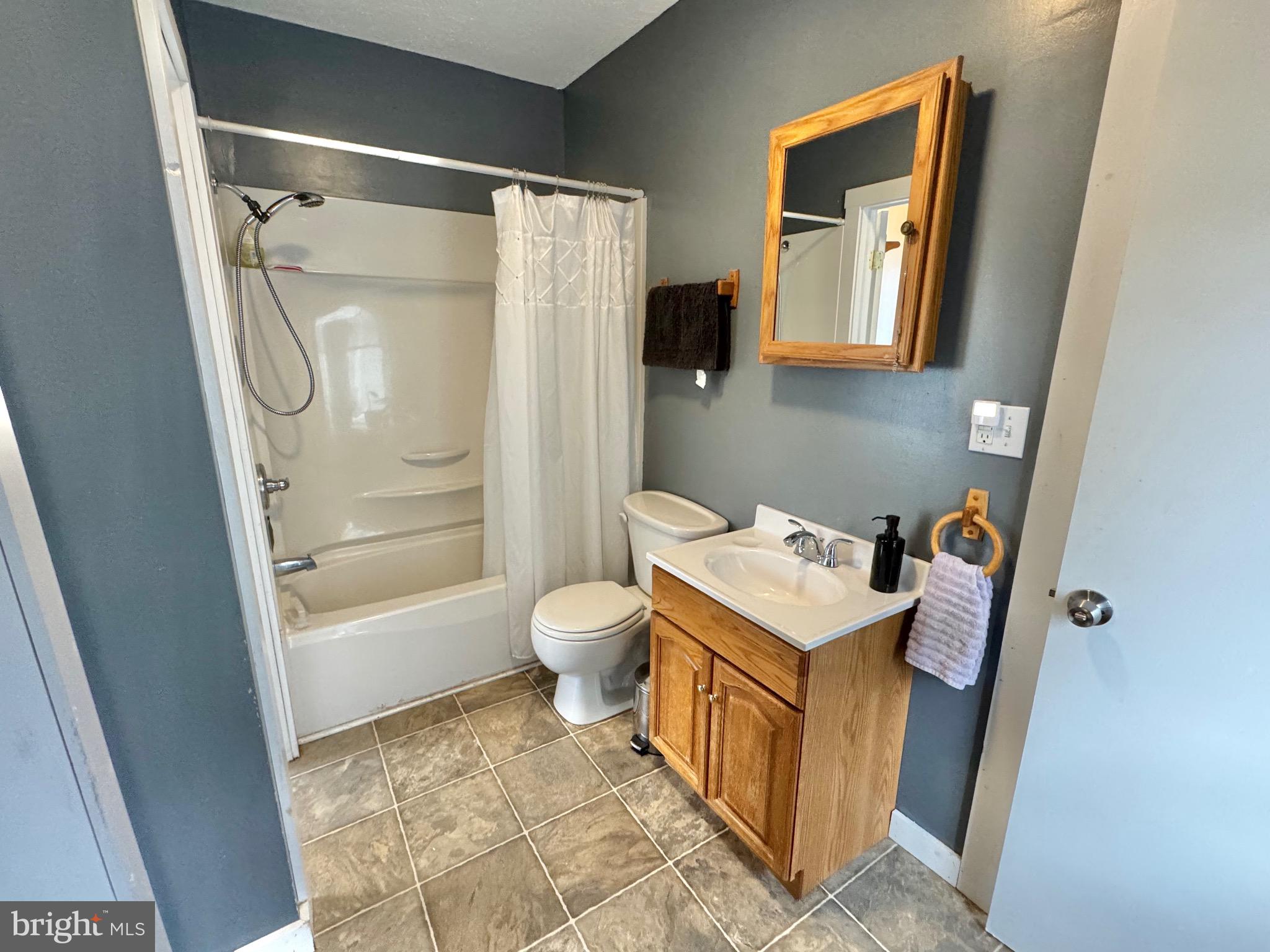 622 Washington Avenue Tyrone, PA 16686 - Photo 16 of 25 a bathroom with a sink toilet and shower