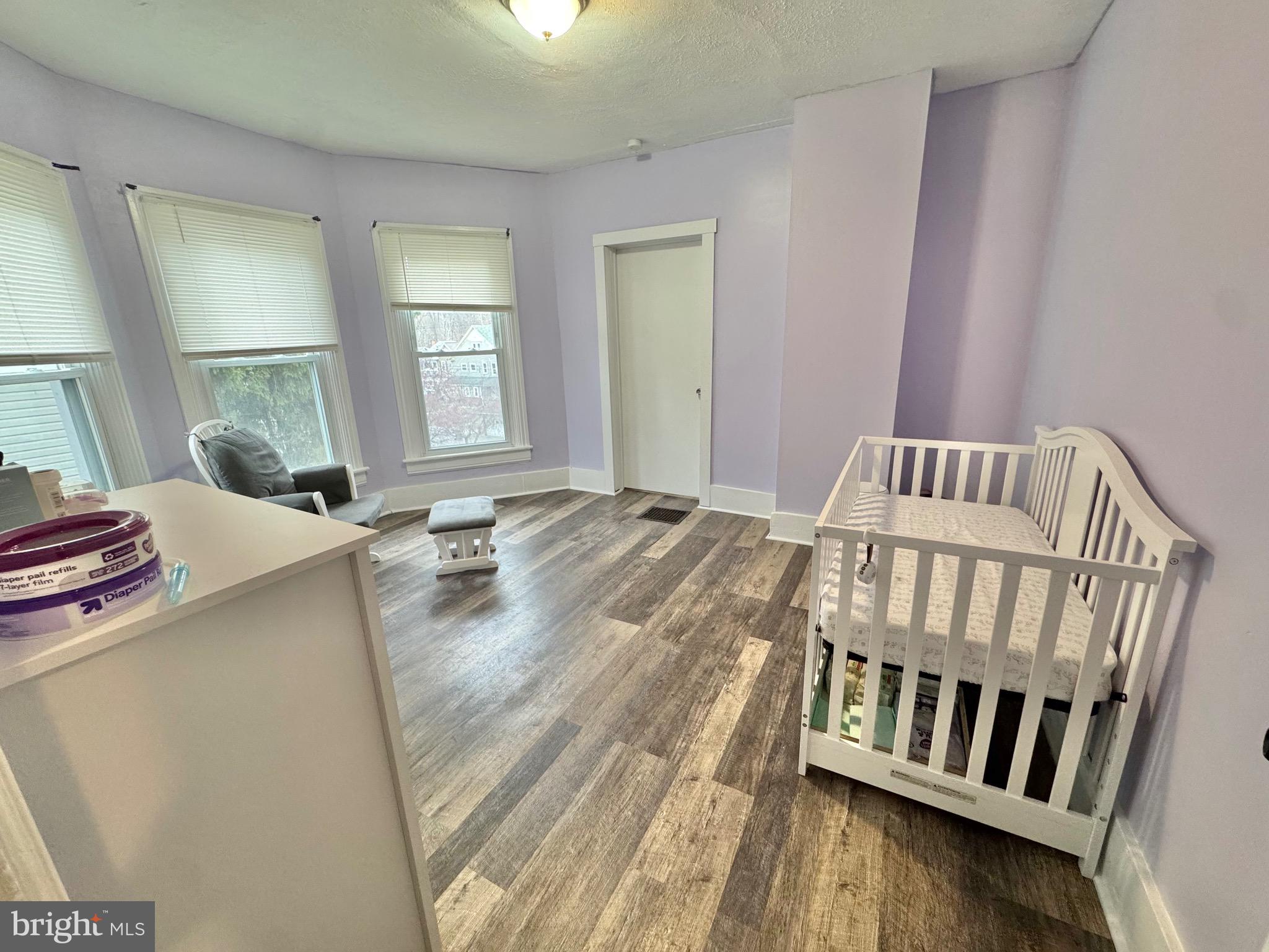 622 Washington Avenue Tyrone, PA 16686 - Photo 17 of 25 a bedroom with a bed and wooden floor