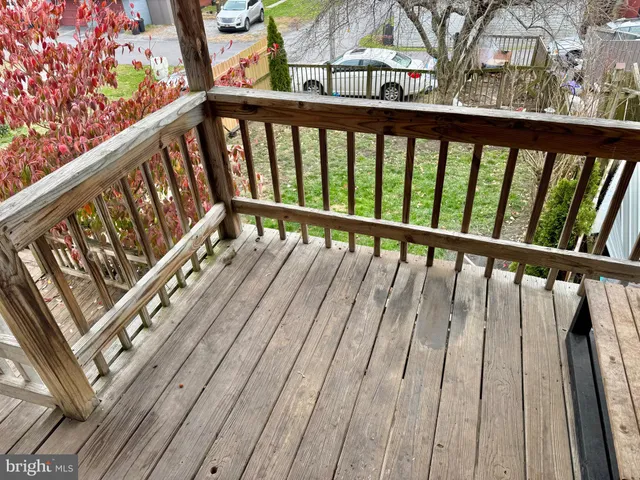 a view of balcony with wooden floor