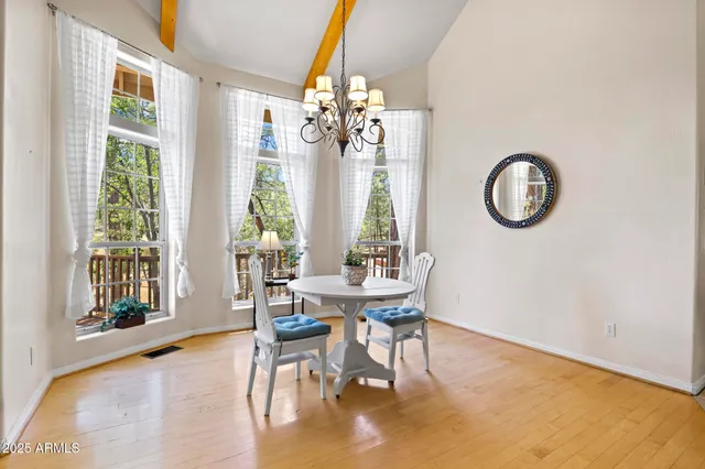 a view of a dining room with furniture window and outside view
