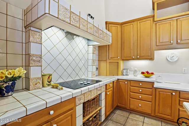 a kitchen that has a sink and a stove