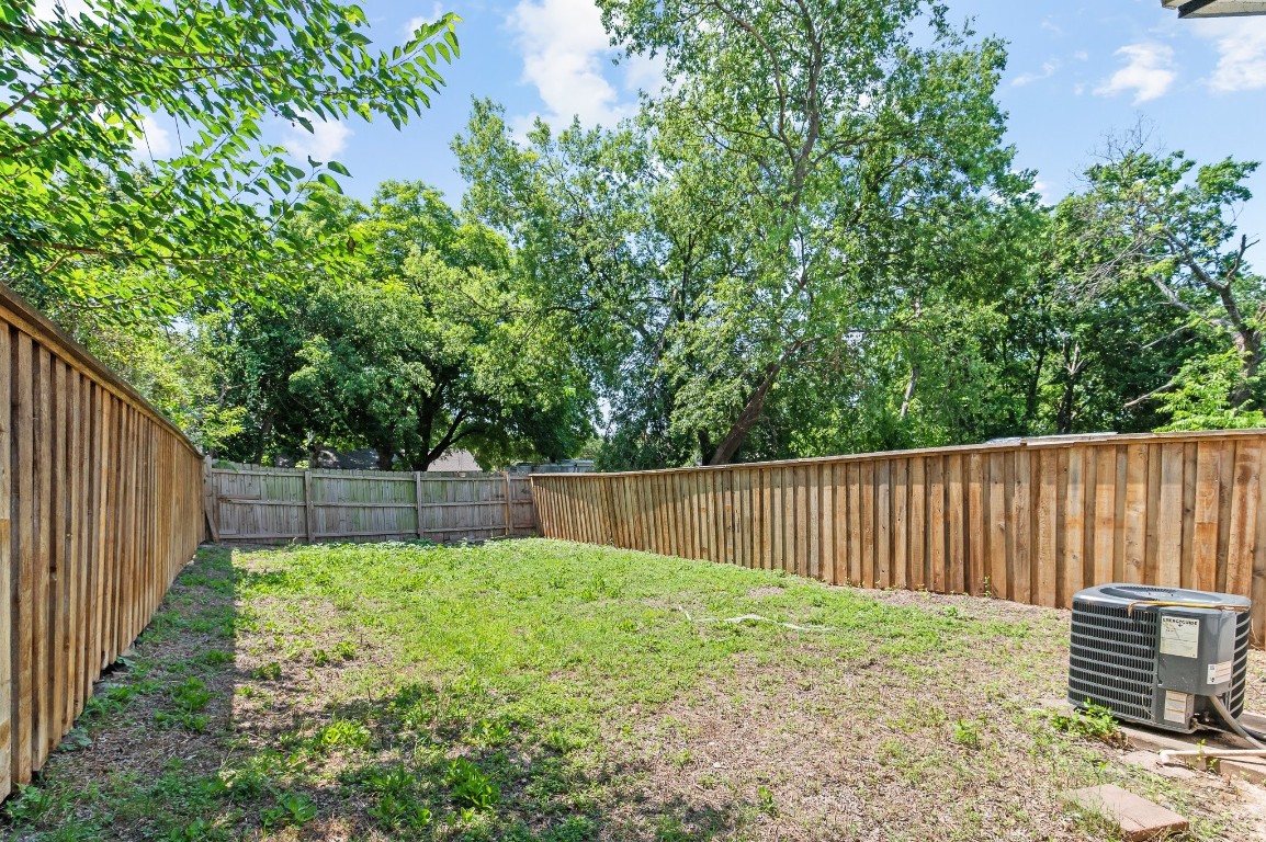 7617 Meador Avenue, Unit B Austin, TX 78752 - Photo 19 of 21 a garden view with tall trees