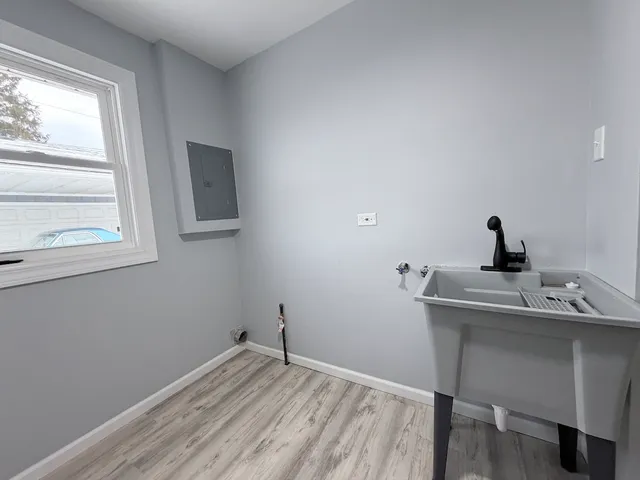 a room with a window and a sink