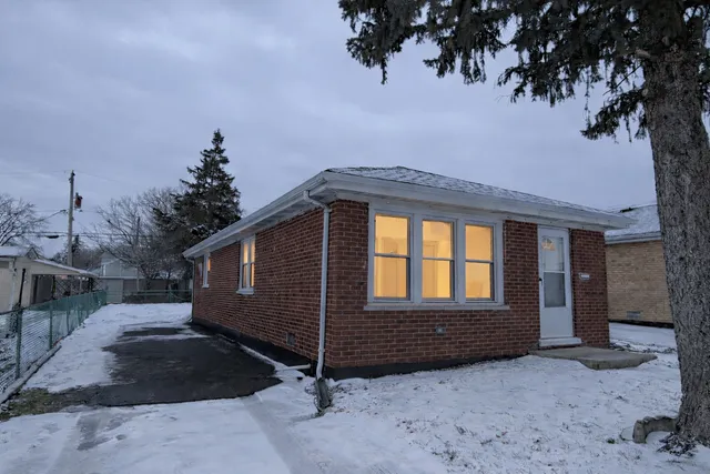 a view of backyard with cabin and wooden fence