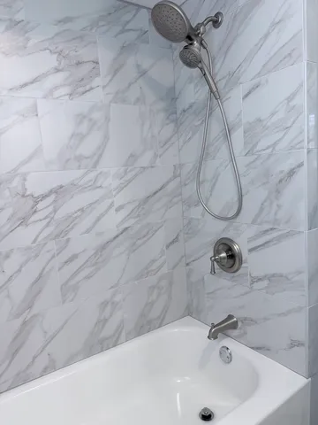 a bathroom with a sink and a shower