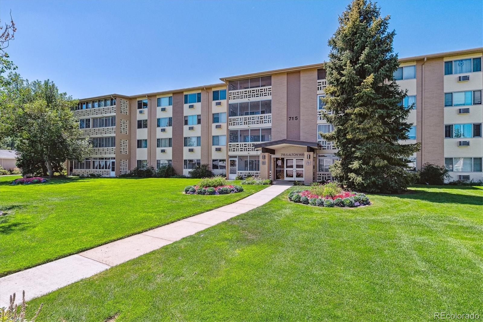 715 South Alton Way, Unit 5A Denver, CO 80247 - Photo 21 of 50 a view of a house with a yard and sitting area
