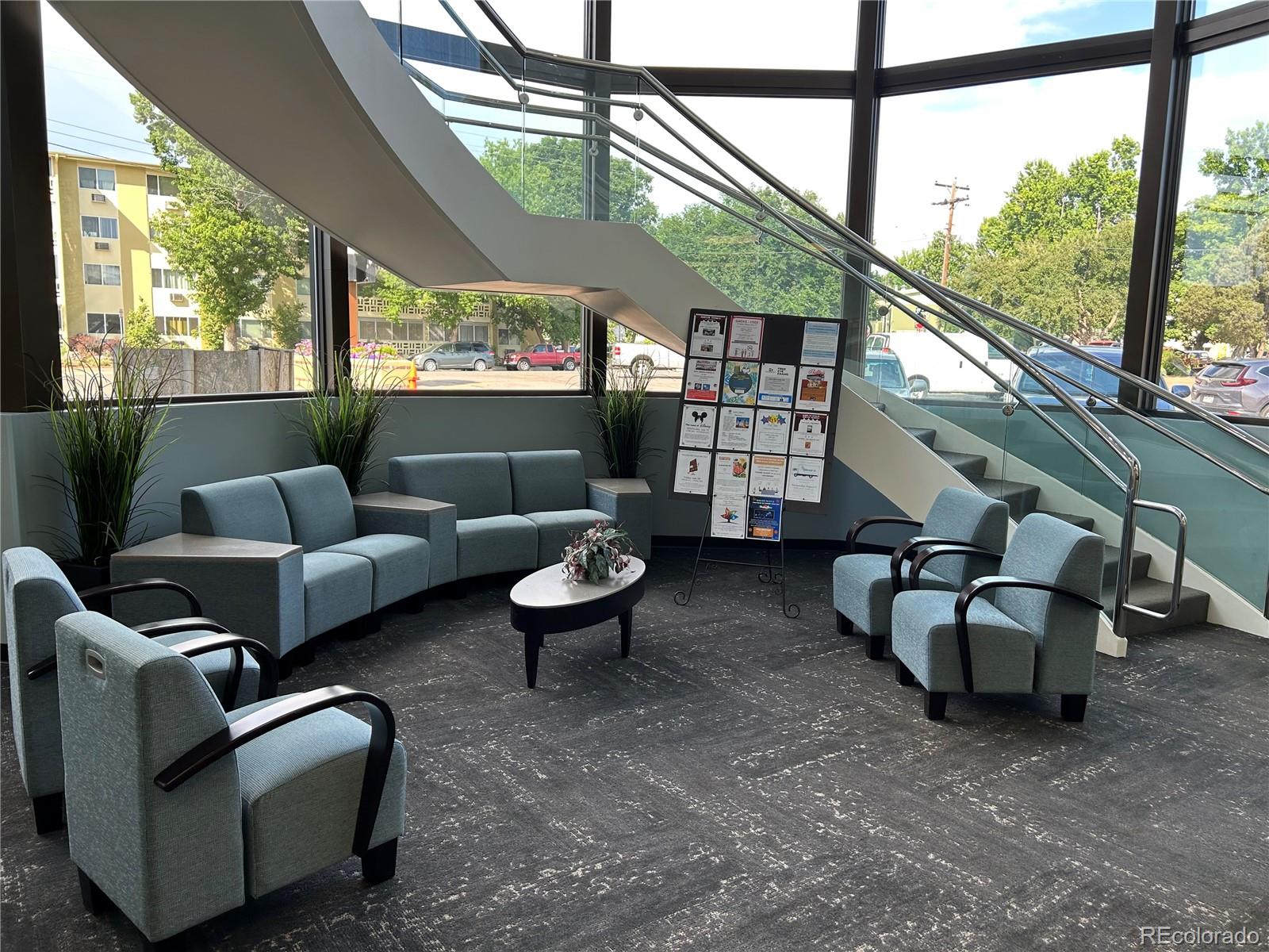 715 South Alton Way, Unit 5A Denver, CO 80247 - Photo 24 of 50 a living room with furniture and a window