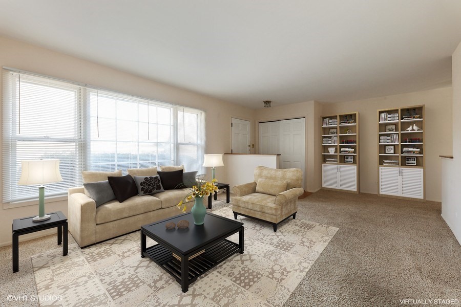 829 Hibbard Road Wilmette, IL 60091 - Photo 2 of 12 a living room with furniture and a large window