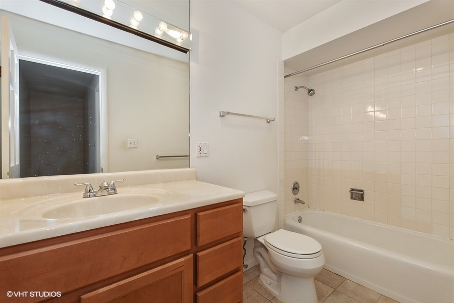 829 Hibbard Road Wilmette, IL 60091 - Photo 11 of 12 a bathroom with a sink a toilet and shower