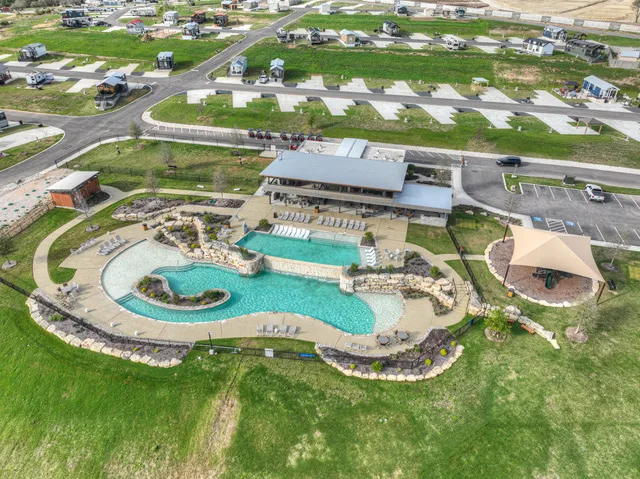 an aerial view of a house with outdoor space