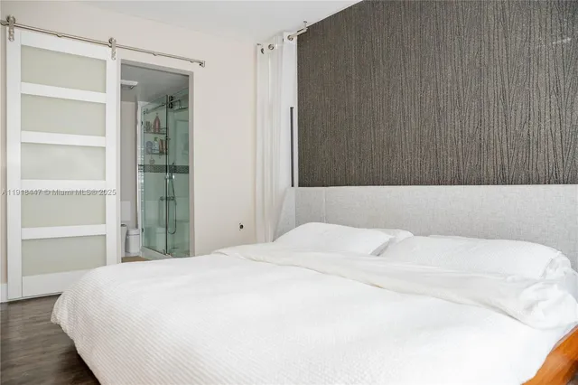 a large white bed in a white room
