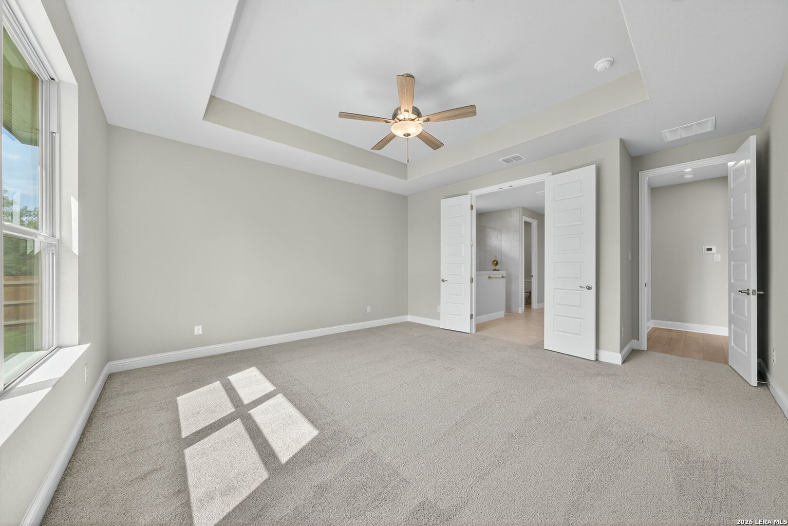254 Allen Avenue Castroville, TX 78009 - Photo 16 of 24 an empty room with fan and windows