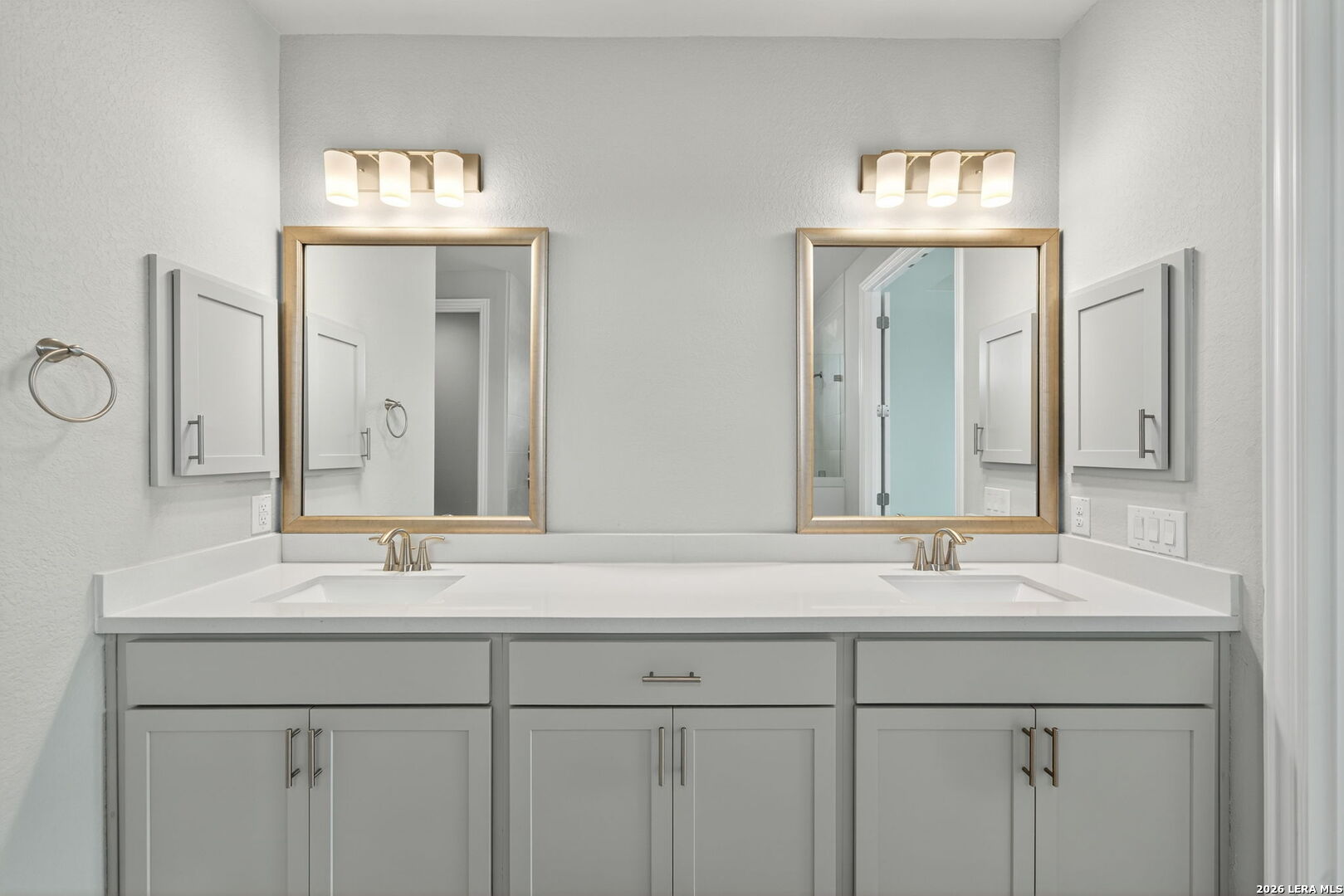 254 Allen Avenue Castroville, TX 78009 - Photo 18 of 24 a bathroom with double sink and a mirror