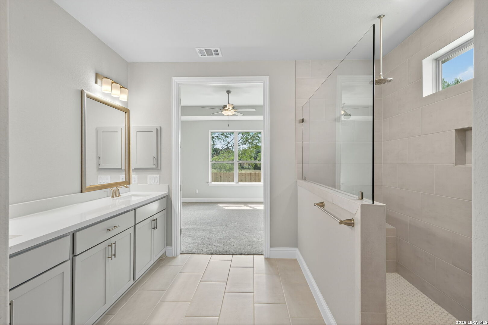 254 Allen Avenue Castroville, TX 78009 - Photo 19 of 24 a bathroom with a tub sink and mirror