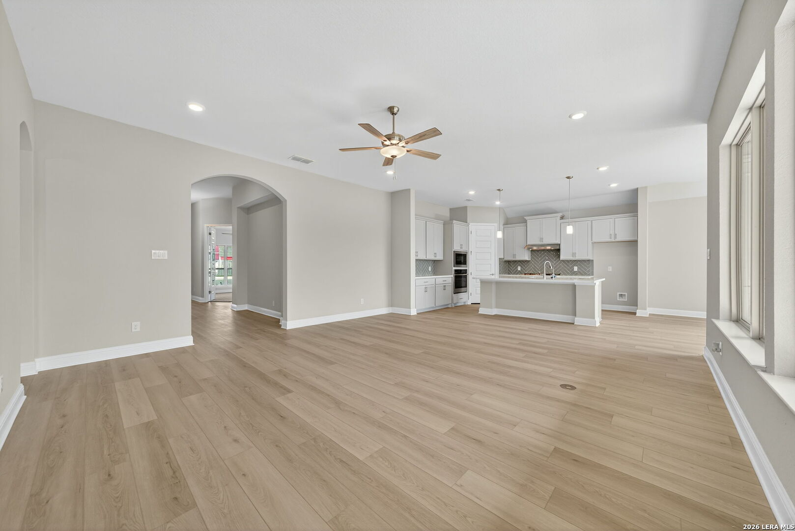 254 Allen Avenue Castroville, TX 78009 - Photo 6 of 24 a view of a kitchen with a sink and a stove