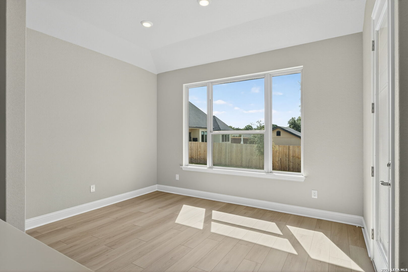254 Allen Avenue Castroville, TX 78009 - Photo 10 of 24 a view of an empty room with a window