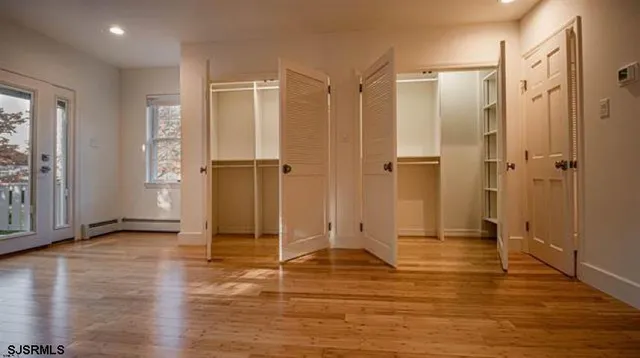 a bathroom with a shower and a glass door