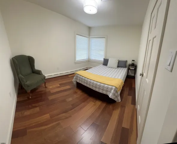 a bedroom with a bed and a chair