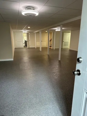 an empty room with a empty space and windows