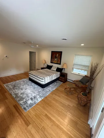 a bedroom with two beds and a chandelier