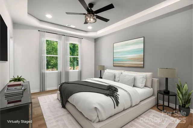 a bedroom with a large bed and a window