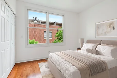 a bedroom with bed and a window