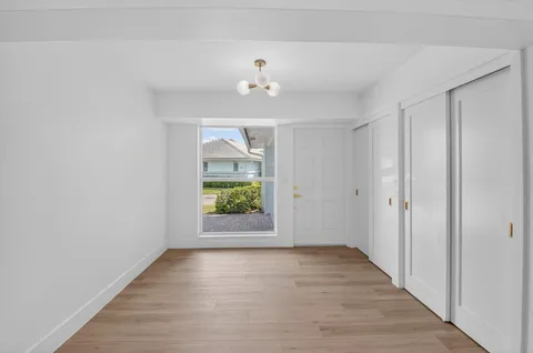 a view of a workspace with furniture and a bookshelf