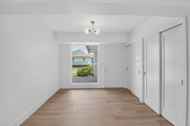 a view of a workspace with furniture and a bookshelf