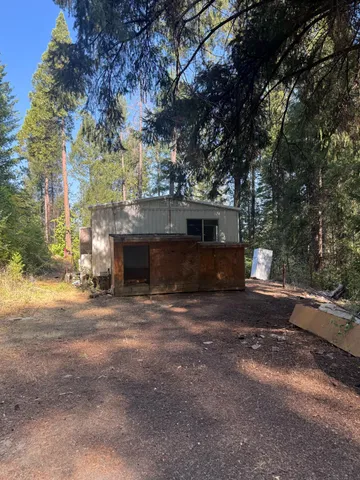 a front view of a house with a yard and a garage