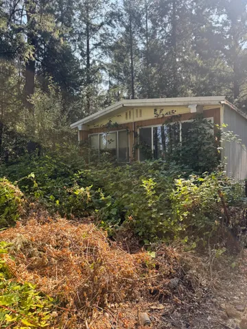 a house view with a backyard space