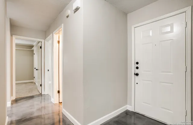 an empty room with wooden floor