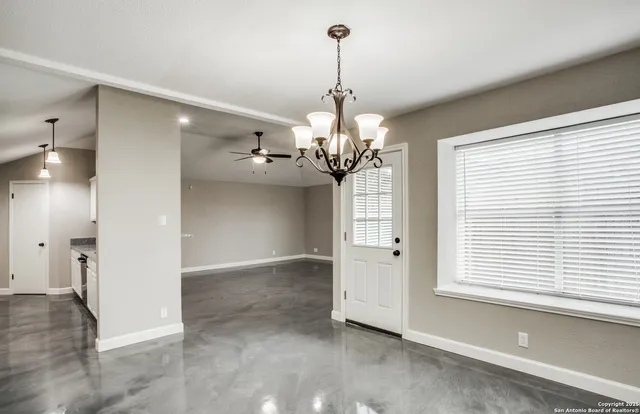 a view of a chandelier and a chandelier in a room
