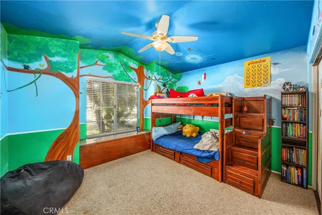 a view of a patio with table and chairs potted plants with floor to ceiling window and potted plants