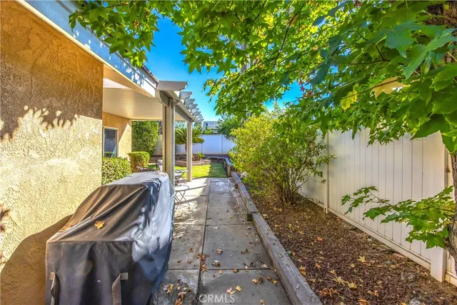 a view of a backyard with large trees