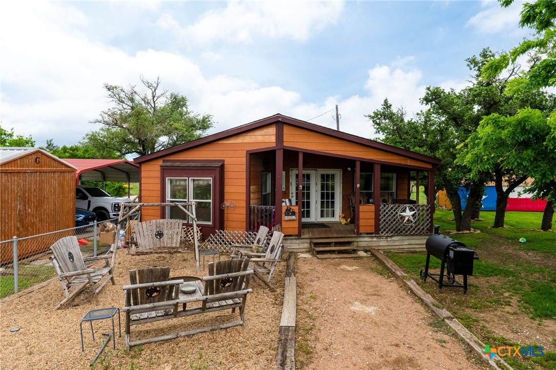 164 County Road 4450 Kempner, TX 76539 - Photo 1 of 44 a view of a house with backyard porch and sitting area