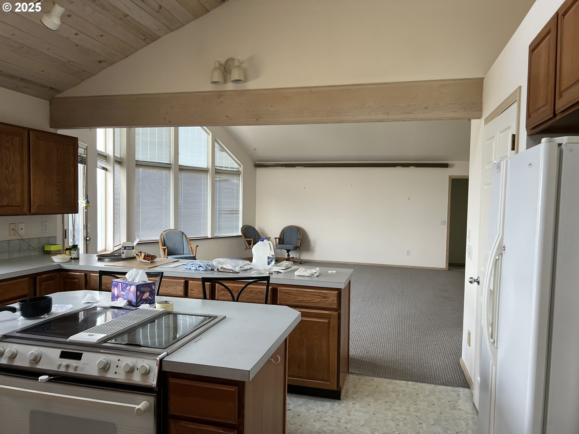 33636 Ophir Road Gold Beach, OR 97444 - Photo 13 of 22 a kitchen with stainless steel appliances granite countertop a sink stove and refrigerator