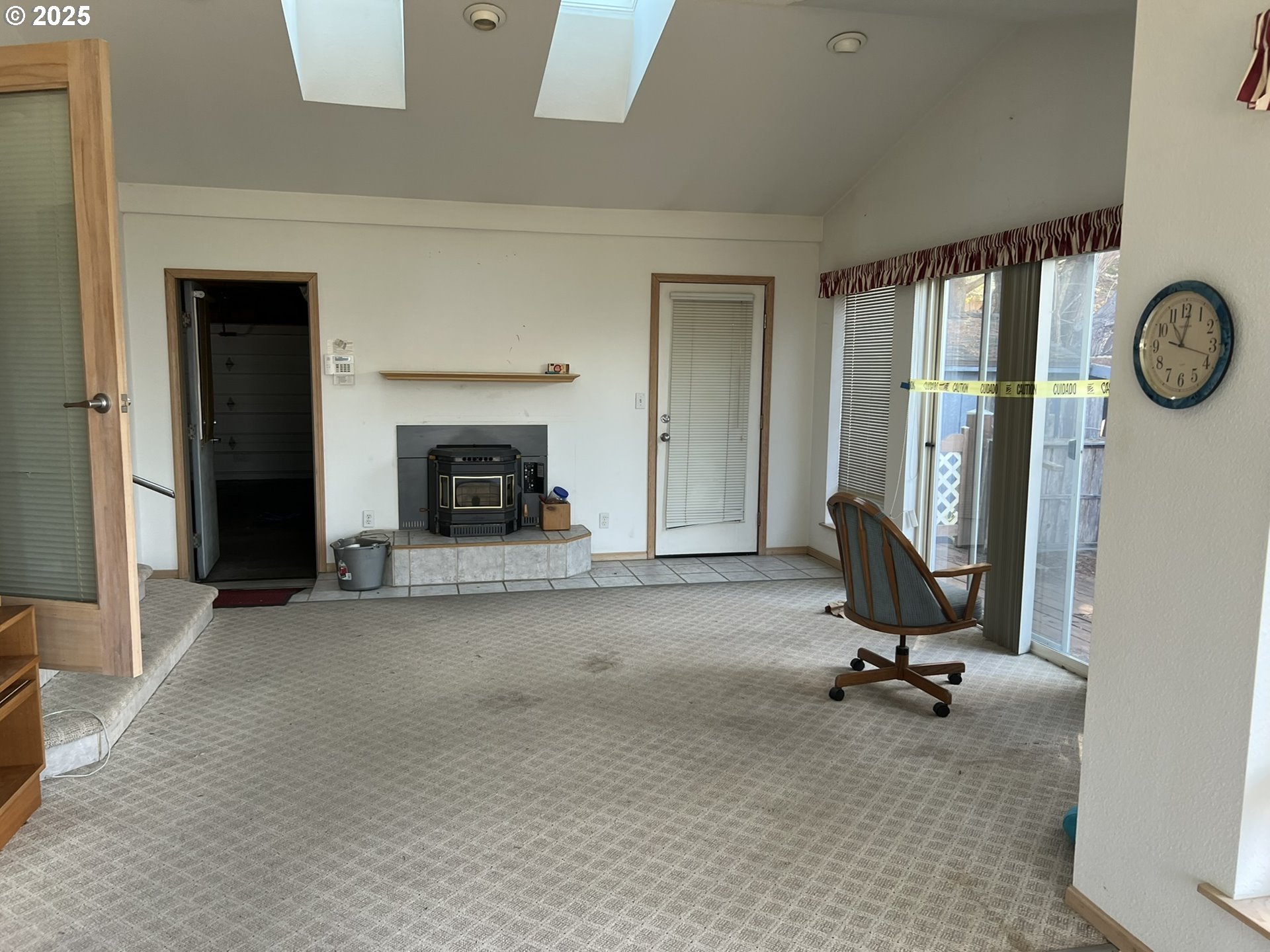 33636 Ophir Road Gold Beach, OR 97444 - Photo 15 of 22 a view of a livingroom with a fireplace and a window