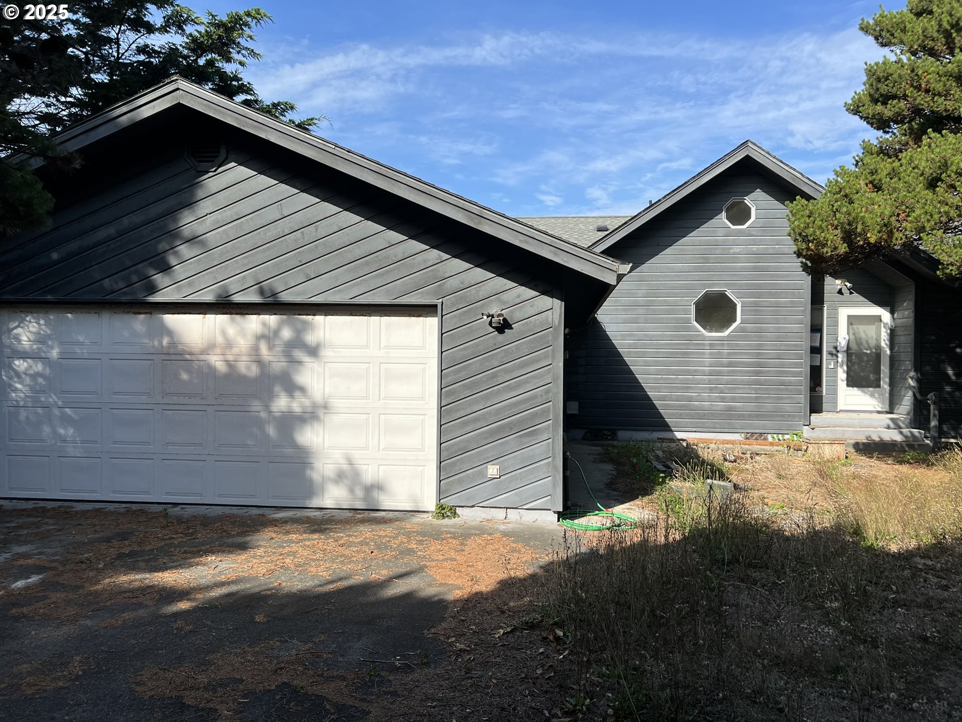 33636 Ophir Road Gold Beach, OR 97444 - Photo 20 of 22 a view of backyard of the house
