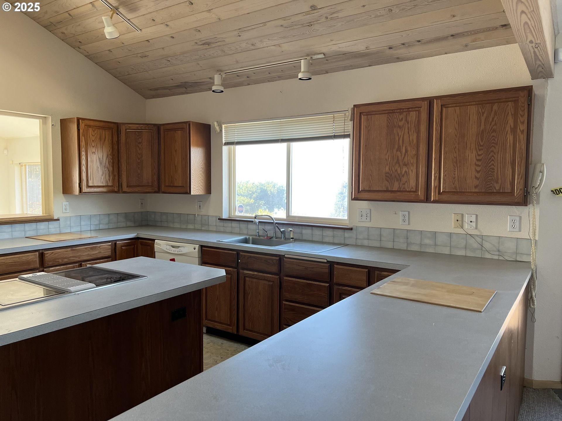 33636 Ophir Road Gold Beach, OR 97444 - Photo 21 of 22 a kitchen that has a sink and a stove in it