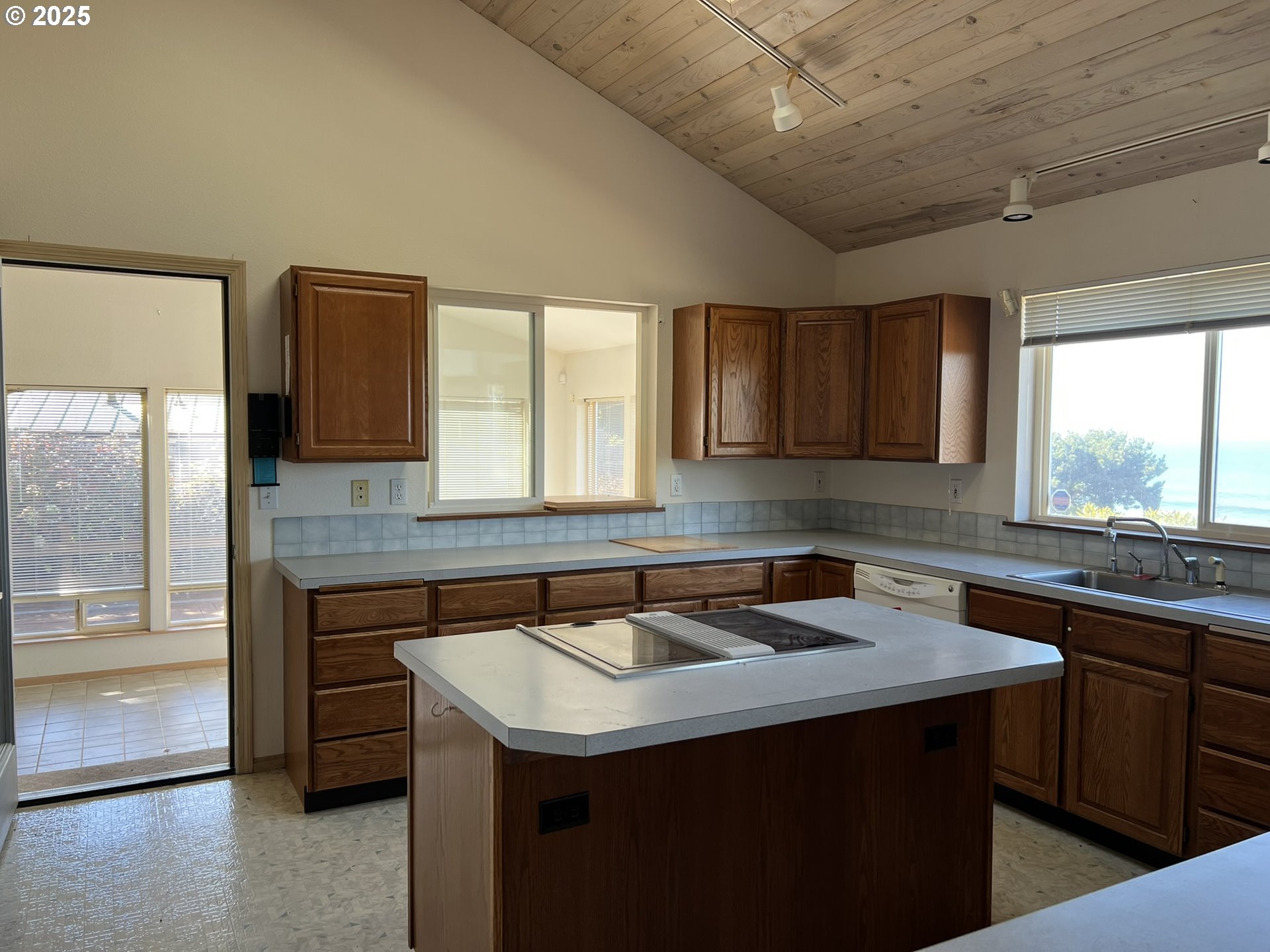 33636 Ophir Road Gold Beach, OR 97444 - Photo 22 of 22 a kitchen with a sink a counter top space and cabinets