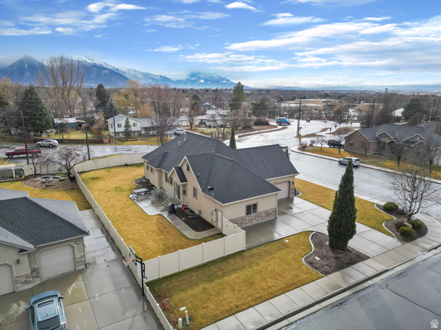 557 South 1470th Street East Springville, UT 84663 - Photo 46 of 46 Aerial perspective of suburban area featuring a mountainous background