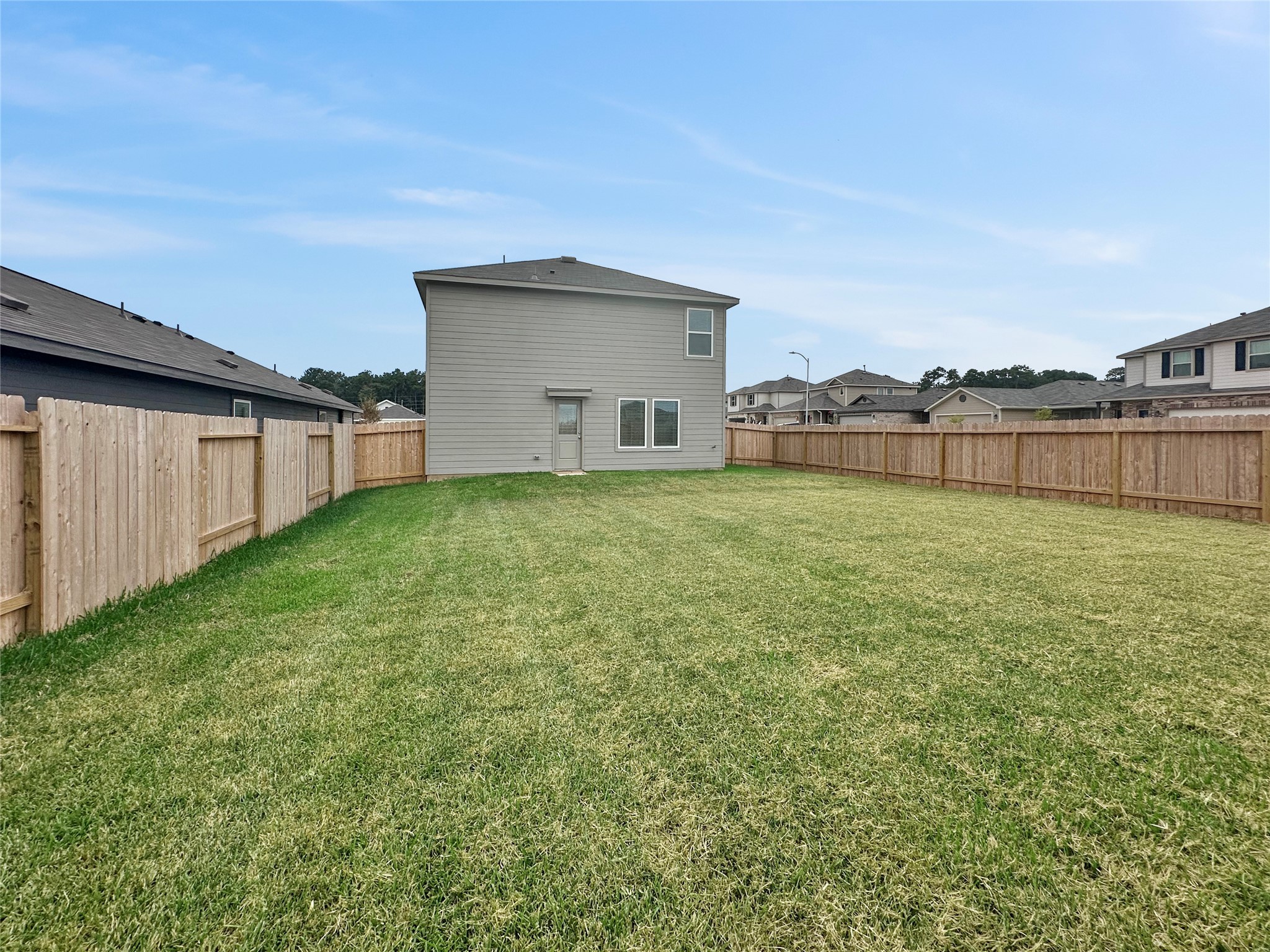 31460 Moore Road Magnolia, TX 77354 - Photo 16 of 17 a view of a backyard with a lake view