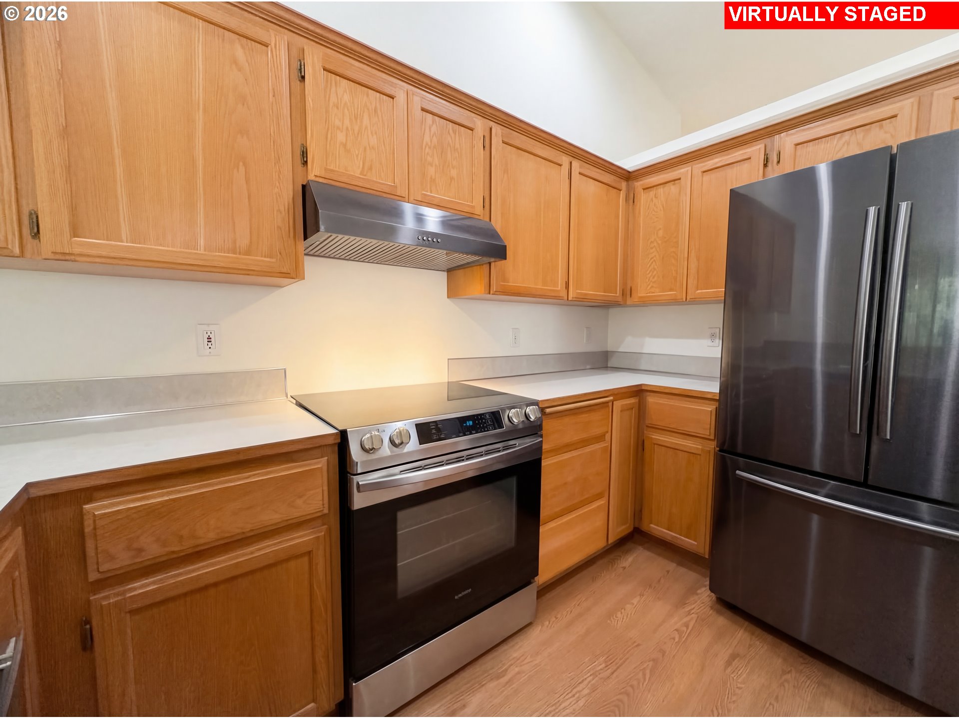 8641 Northeast Windstone Street Beaverton, OR 97006 - Photo 2 of 18 a kitchen with a stove sink and refrigerator