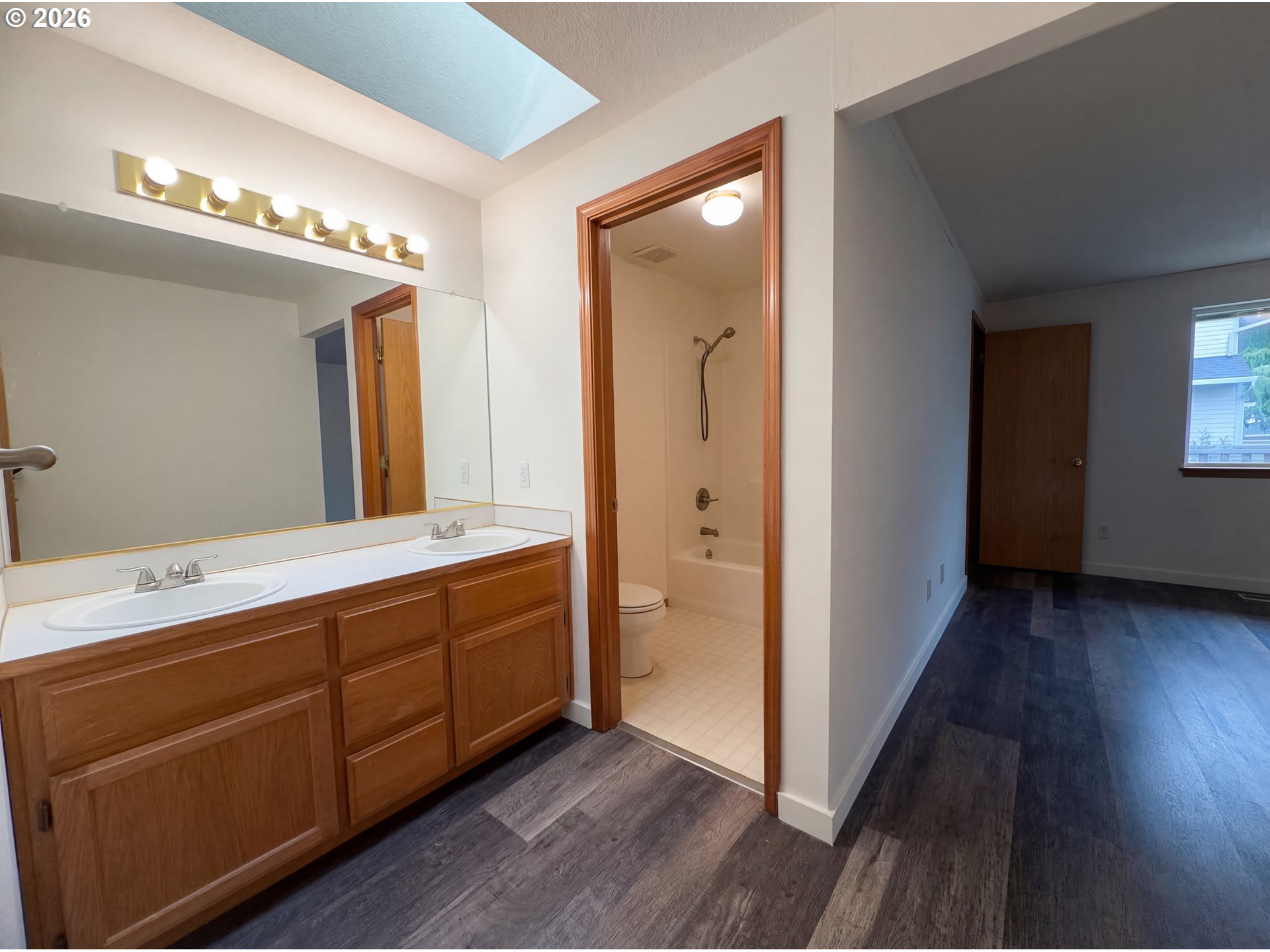 8641 Northeast Windstone Street Beaverton, OR 97006 - Photo 8 of 18 a bathroom with a double vanity sink and a mirror